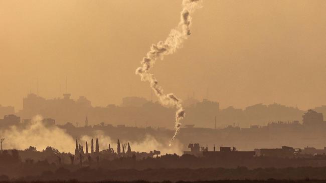 A flare falls during Israeli bombardment in the Gaza Strip off a position across the border in southern Israel. Picture: AFP