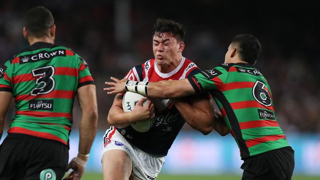 Roosters centre Joseph Manu takes on the Rabbitohs defence at Allianz Stadium. Picture: Brett Costello