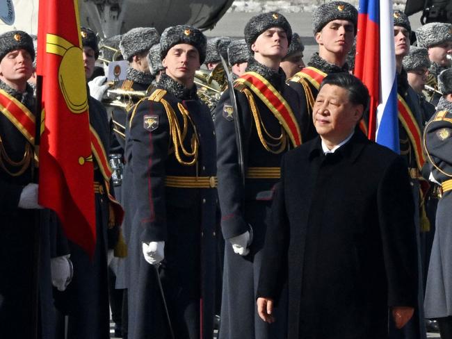 China's President Xi Jinping walks past honour guards during a welcoming ceremony at Moscow's Vnukovo airport on March 20, 2023. - Chinese leader arrived in Moscow on Monday saying his first state visit to Russia since the Ukraine conflict broke out would give "new momentum" to bilateral ties. (Photo by Anatoliy Zhdanov / Kommersant Photo / AFP) / Russia OUT