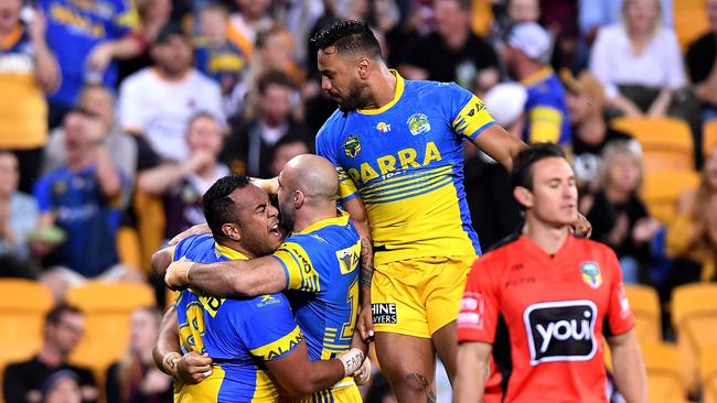 Kirisome Auva'a is congratulated by team mates after scoring the fastest NRL try in history.