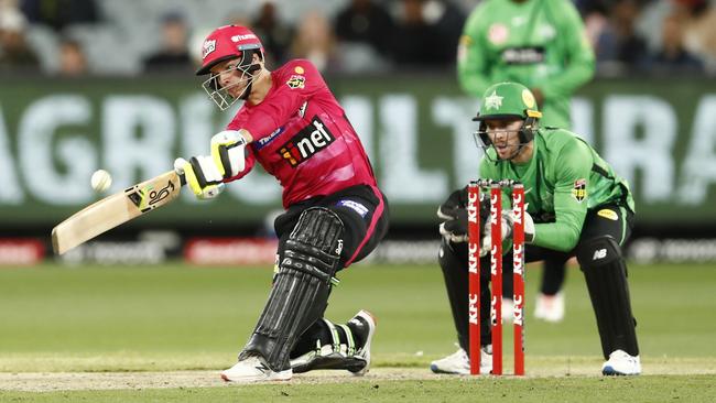 MELBOURNE, AUSTRALIA - DECEMBER 15:  Josh Philippe of the Sydney Sixers hits a six and the winning runs to finish on 99 not out during the Men's Big Bash League match between the Melbourne Stars and the Sydney Sixers at Melbourne Cricket Ground, on December 15, 2021, in Melbourne, Australia. (Photo by Darrian Traynor/Getty Images) *** BESTPIX ***