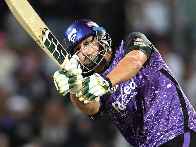 HOBART, AUSTRALIA - JANUARY 14: Tim David of the Hurricanes hits a six during the BBL match between the Hobart Hurricanes and Melbourne Renegades at Blundstone Arena, on January 14, 2025, in Hobart, Australia. (Photo by Steve Bell/Getty Images)