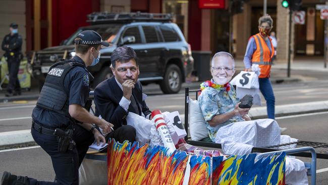 The group has previously targeted Santos outside their building in Adelaide in a protest featuring effigies of then energy minister Angus Taylor and prime minister Scott Morrison. Picture: NCA NewsWire / Naomi Jellicoe