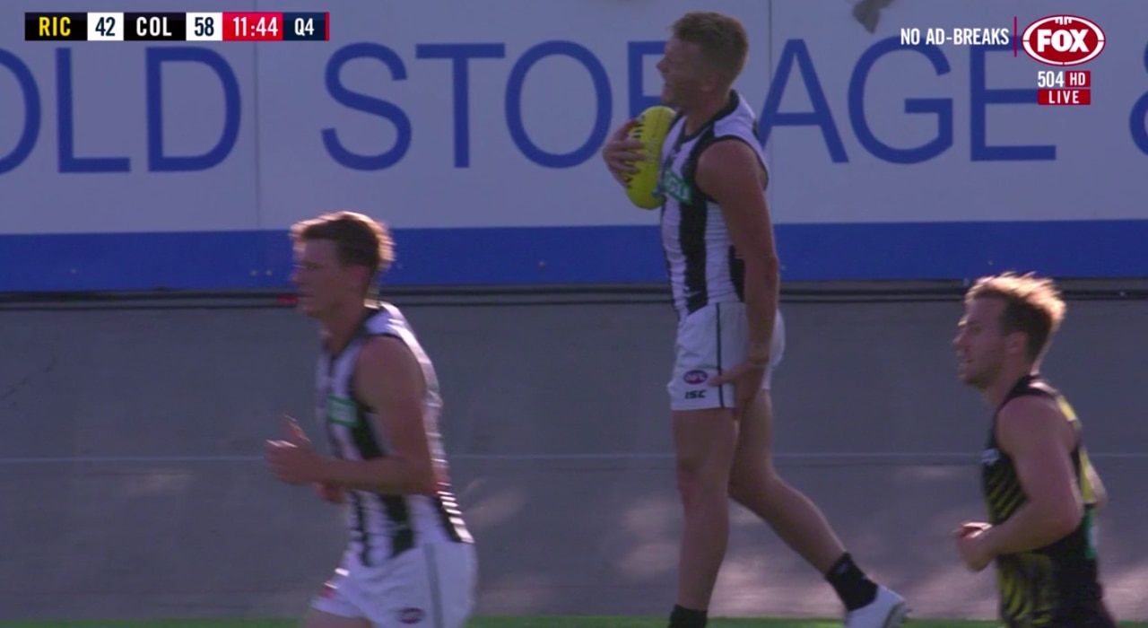 Adam Treloar grabs his hamstring during the final term.