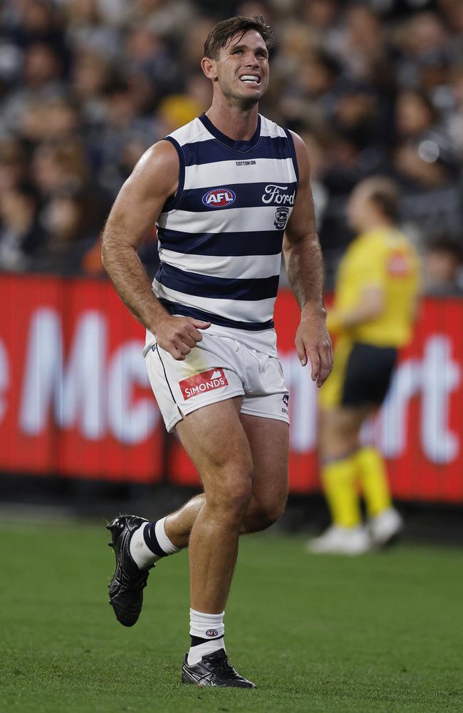 Tom Hawkins limps off the ground against the Blues. Picture: Michael Klein