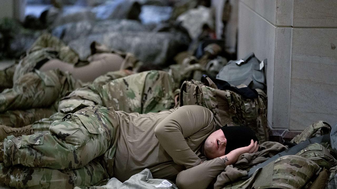 Members of the National Guard sleep in the Capitol building. Picture: Stefani Reynolds/Getty Images/AFP