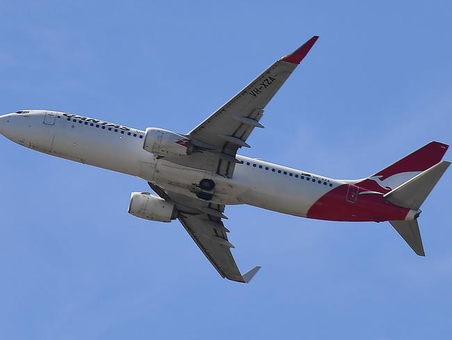 A Qantas Airways plane leaves Sydney Airport. Picture: AFP.