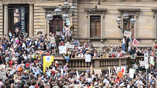 Protesters swarm the Old Treasury Building on Spring St. Picture: AAP