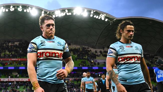 Cameron McInnes and Nicho Hynes of the Sharks walk off the field after losing the NRL Qualifying Final match against the Melbourne Storm. (Photo by Quinn Rooney/Getty Images)