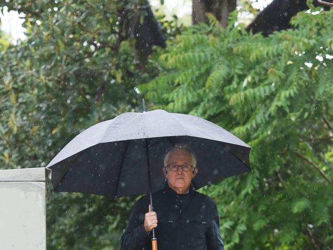 28/11/18: Former PM, Malcolm Turnbull walks in the rain near his home at Point Piper, Sydney. John Feder/The Australian.