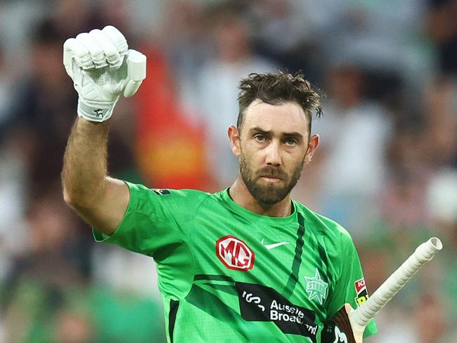 MELBOURNE, AUSTRALIA - JANUARY 19: Glenn Maxwell of the Stars raises his bat after scoring a century during the Men's Big Bash League match between the Melbourne Stars and the Hobart Hurricanes at Melbourne Cricket Ground, on January 19, 2022, in Melbourne, Australia. (Photo by Mike Owen/Getty Images)