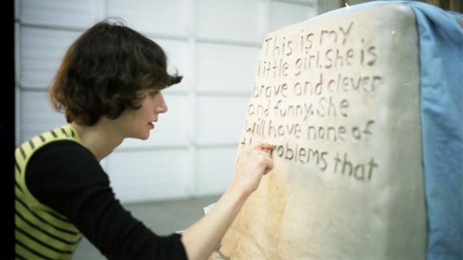 July inscribing text into fibreglass for her artwork Eleven Heavy Things (2009). Picture: Supplied