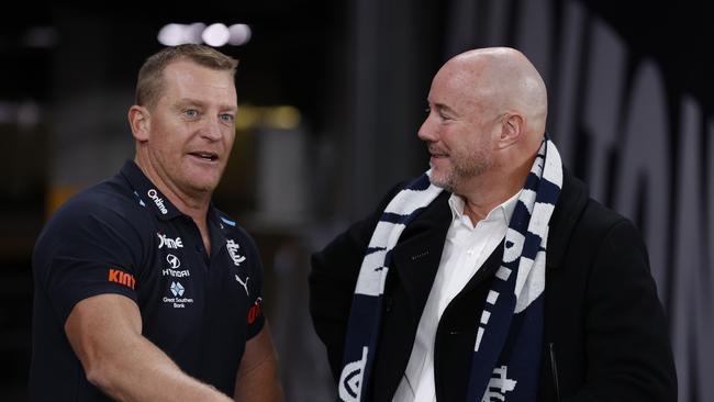 MELBOURNE, AUSTRALIA - APRIL 20:  Michael Voss, Senior Coach of the Blues speaks with President Luke Sayers after the round six AFL match between Carlton Blues and Greater Western Sydney Giants at Marvel Stadium, on April 20, 2024, in Melbourne, Australia. (Photo by Darrian Traynor/Getty Images)