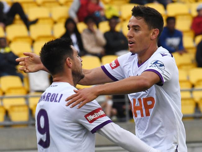 Christopher Ikonomidis of Perth Glory FC, right, celebrates with Bruno Fornaroli of Perth Glory FC after scoring against the Phoenix during the Round 3 A-League match between the Wellington Phoenix and the Perth Glory at Westpac Stadium in Wellington, Sunday, October 27, 2019. (AAP Image/Ross Setford) NO ARCHIVING, EDITORIAL USE ONLY
