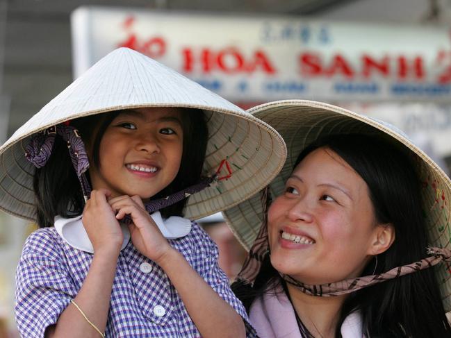 Phuong Trinh with daughter Catherine, 6, at Cabramatta in Sydney as suburb is being readied for Moon Festival.