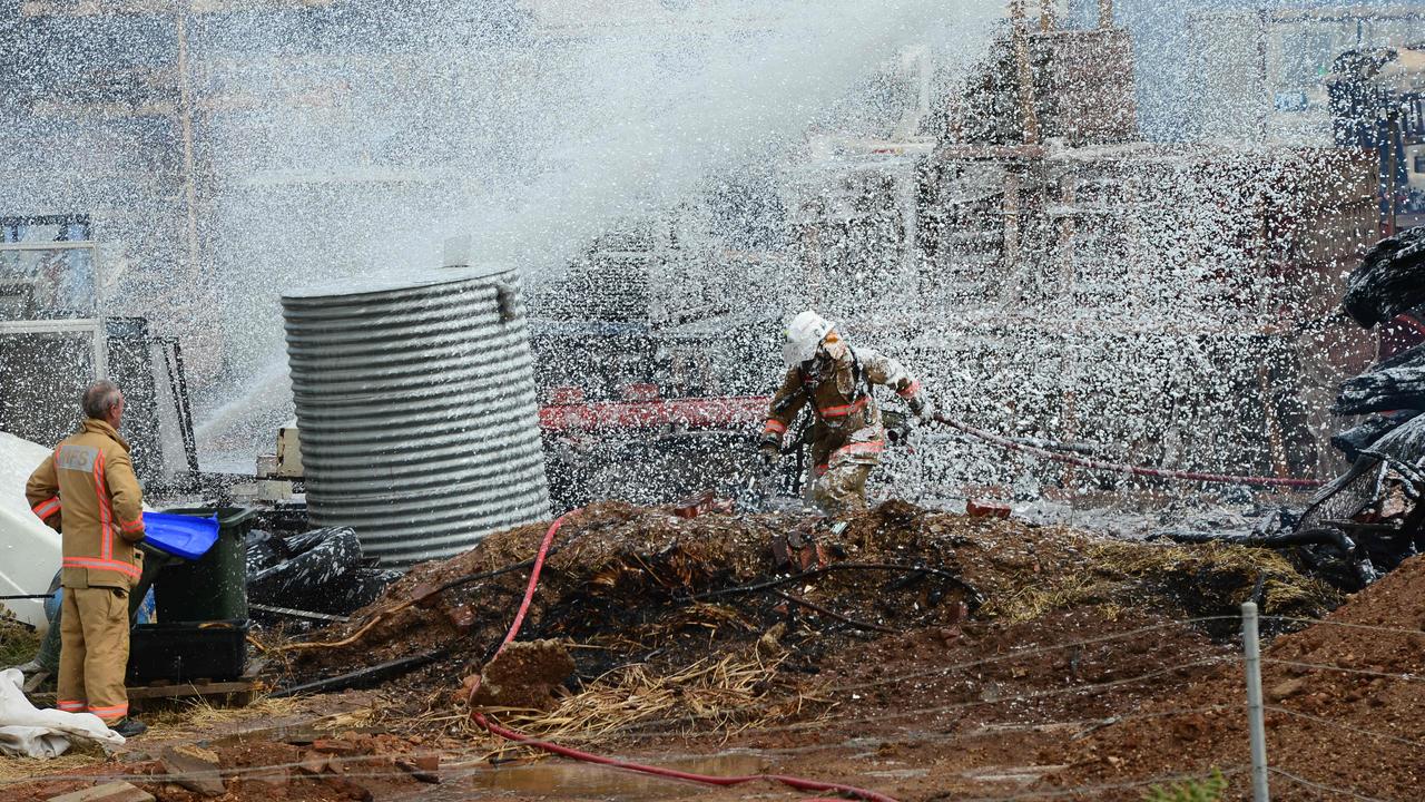 MFS firefighter covered by foam as he fights a factory fire in Wingfield. Picture: Mark Brake