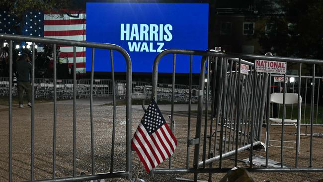 US flags are seen on the ground as people left the election night event for US Vice President and Democratic presidential candidate Kamala Harris at Howard University in Washington, DC, on November 6, 2024. (Photo by ANGELA WEISS / AFP)