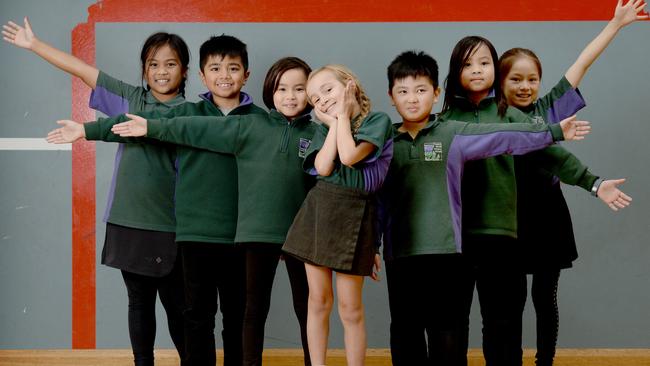 Clementine Struthers flanked by Prospect North Primary School classmates Anh, Rafael, Amy, Kevin, Linh and Tina. Photo: Naomi Jellicoe