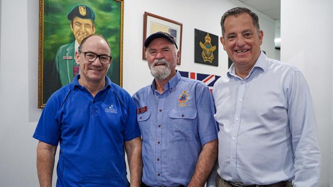 ReNew Mackay property developers Sean Kelly (left) and Craig Percival (right) with Mackay RSL sub-branch president Ken Higgins at the RSL sub-branch's new headquarters along Sydney Street in Mackay. They are standing in front of an original portrait of Australia’s oldest surviving Victoria Cross recipient, Mackay veteran Keith Payne. Mr Higgins said he was excited to pick up Keith and Flo and take them on a tour once the place was a little more spruced up. Picture: Heidi Petith