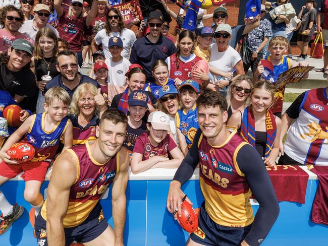 Josh Dunkley and Jarrod Berry surrounded by Lions fans at Brighton Homes Arena at BrisbaneÃs final training session before heading to Melbourne for the Grand Final against the Sydney Swans. Picture Lachie Millard