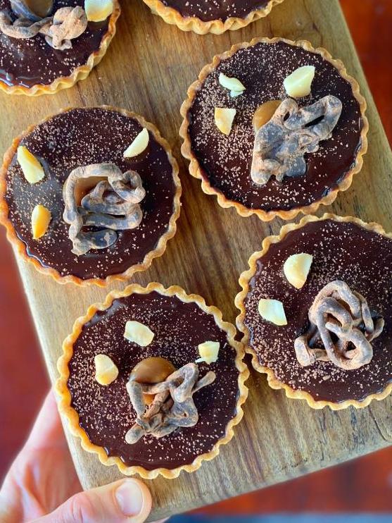 Salted caramel and dark chocolate tarts. Picture: Supplied