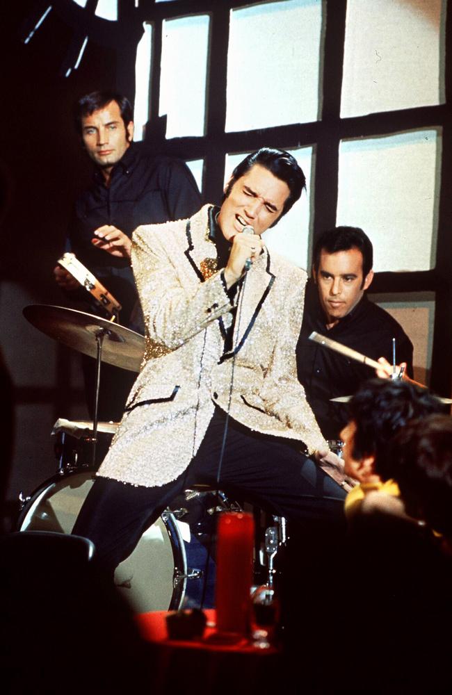 Elvis Presley performing in concert.