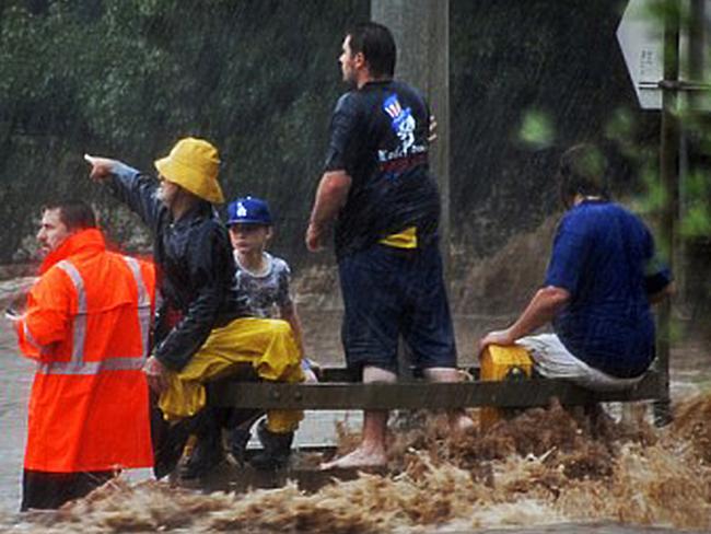Blake Rice, centre left, was rescued during the floods but older brother Jordan and mother Donna were swept away. Picture courtesy of Troy Campbell