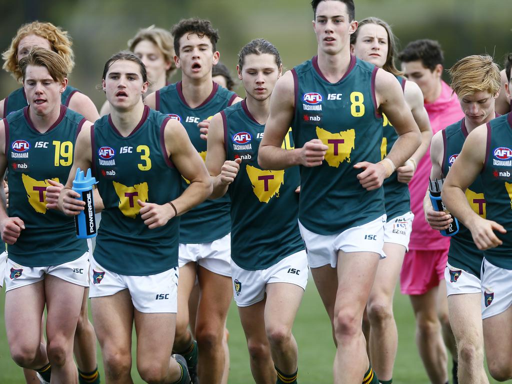 AFL - Tasmania Devils under-18 team in NAB League game against the Northern Knights at Twin Ovals, Kingston. (L-R)The team running on the field after the half time break. Picture: MATT THOMPSON