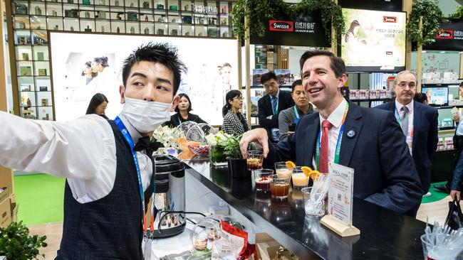 Australia’s Trade, Tourism &amp; Investment Minister Simon Birmingham trying vitamin drinks at the China International Import Expo in Shanghai in 2018. Picture: Supplied