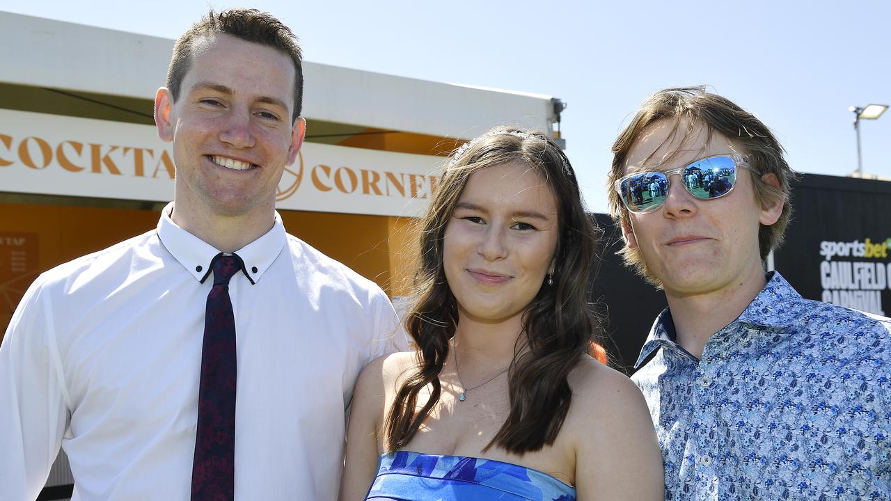 Caulfield Guineas horse race meeting, Caulfield, Victoria, Saturday 12th October 2024. Faces in the crowd. Pictured enjoying the race meeting are Mitch, Emma and Heth. Picture: Andrew Batsch