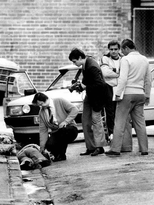 Detective Roger Rogerson (far right) and colleagues stand over Warren Lanfranchi’s body. Picture: Frank Violi