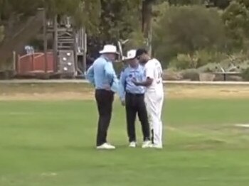 Umpires check the state of the ball with the Haig Fawkner skipper.