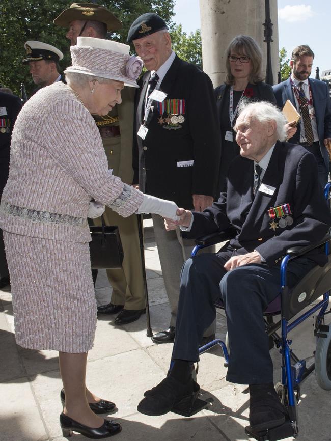 Moving moment ... Queen Elizabeth II meets veteran John Dean as she leaves a Service of Commemoration at St Martin-in-the-Fields church. Picture: AFP/Arthur Edwards