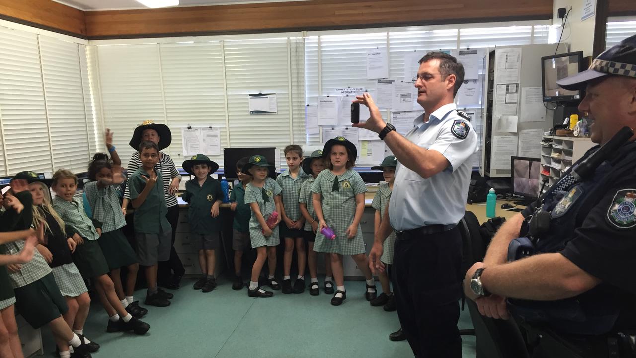 Sgt Gregory showing St Mary's School students around Bowen Police Station in 2016.