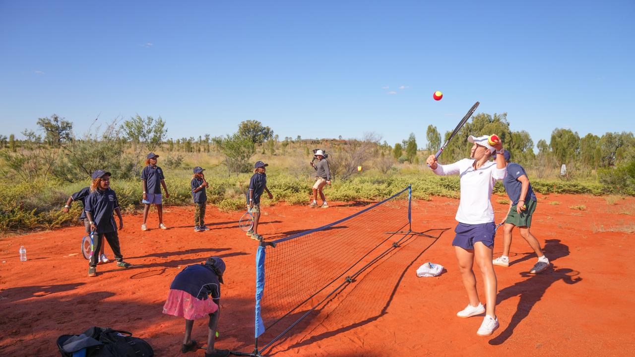 Barty plays tennis with Mutitjulu school students in Uluru-Kata Tjuta National Park. Picture: Scott Barbour/Tennis Australia