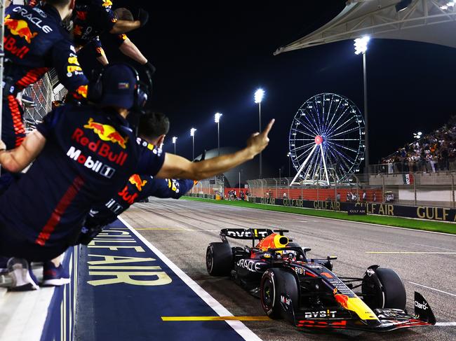 Race winner Max Verstappen of the Netherlands driving the Oracle Red Bull Racing RB19 passes his team celebrating on the pitwall during the F1 Grand Prix of Bahrain at Bahrain International Circuit on March 05. Picture: Getty Images