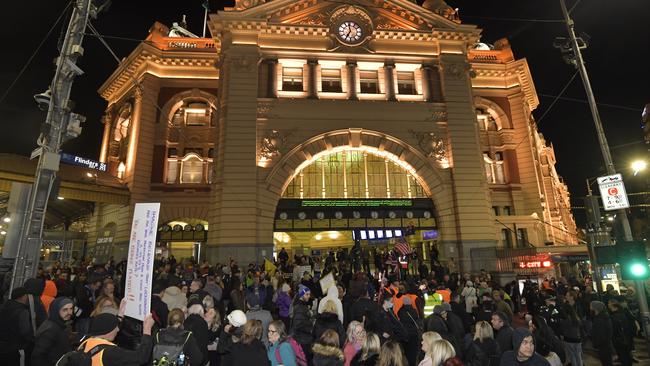 Lockdown protesters at Flinders Street station. Picture: Jason Edwards