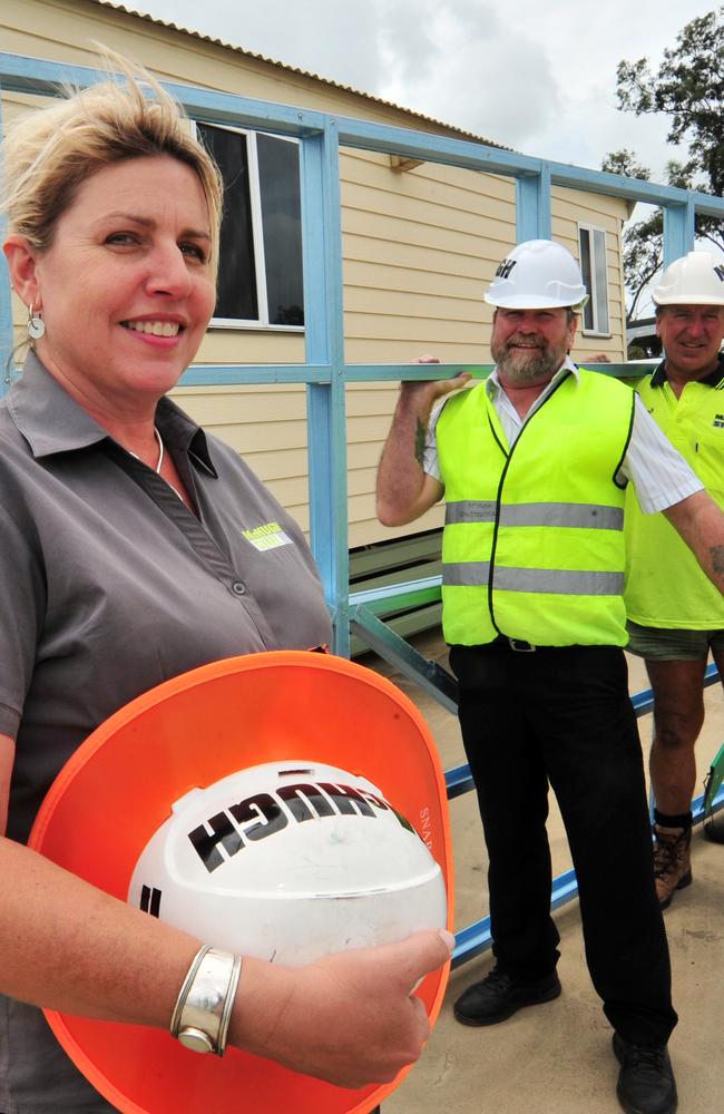 FLOODY GOOD IDEA: McHugh Steel owner Sonja Pressler-Hugh and employees Ray Lyons, Michael McHugh and Russell Wood build demountable cabins for flood prone areas. Photo: Max Fleet/NewsMail