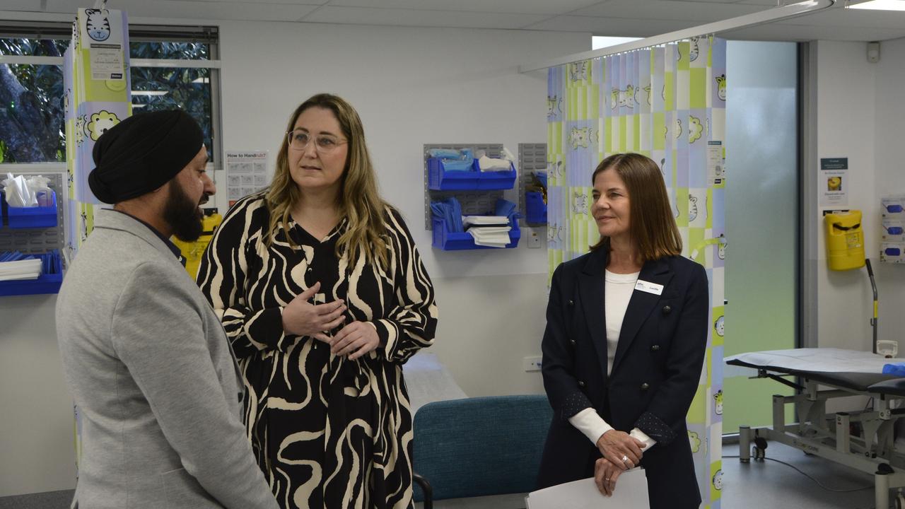 Assistant Minister for Mental Health and Suicide Prevention Emma McBride (centre) speaking with Urgent Care Clinic Director Dr Ajit Bhalla and Darling Downs and West Moreton Public Health Network chief executive Lucille Chalmers.