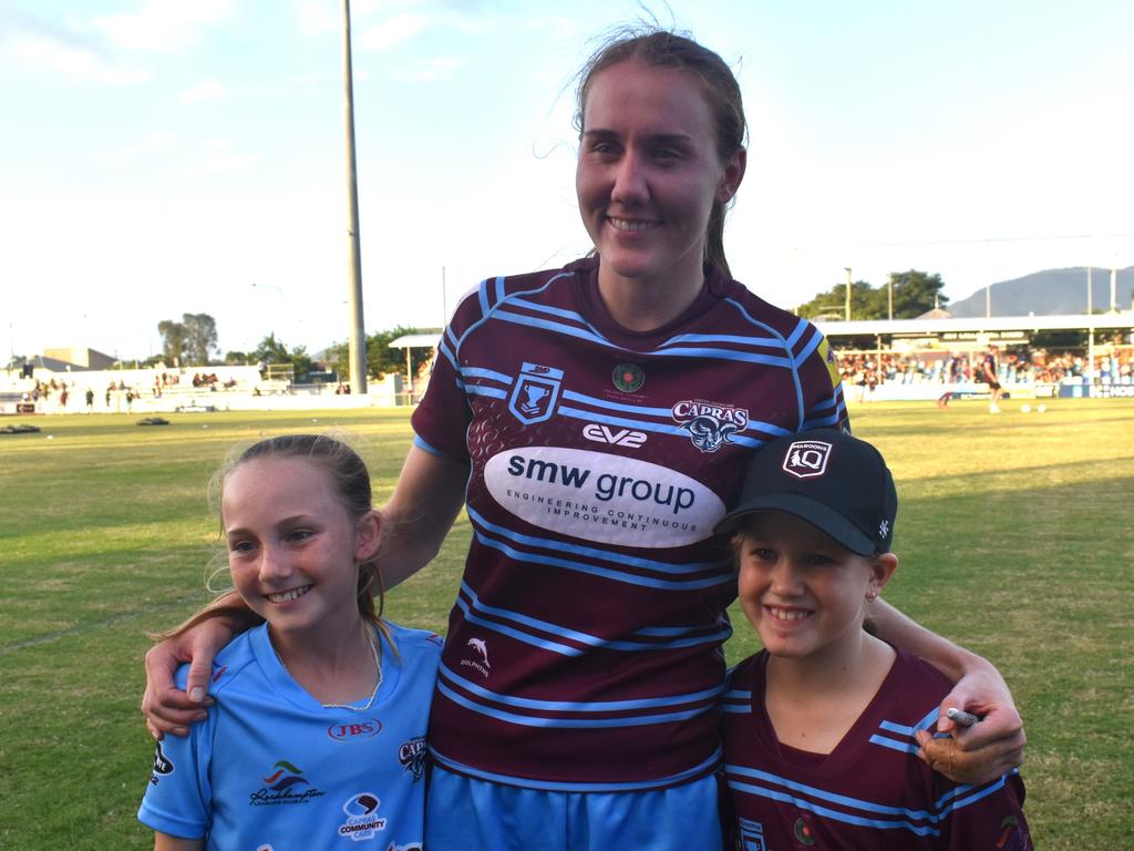 Tamika Upton with young fans Harper Quigley and Annie Brown after a Capras home game at Browne Park.