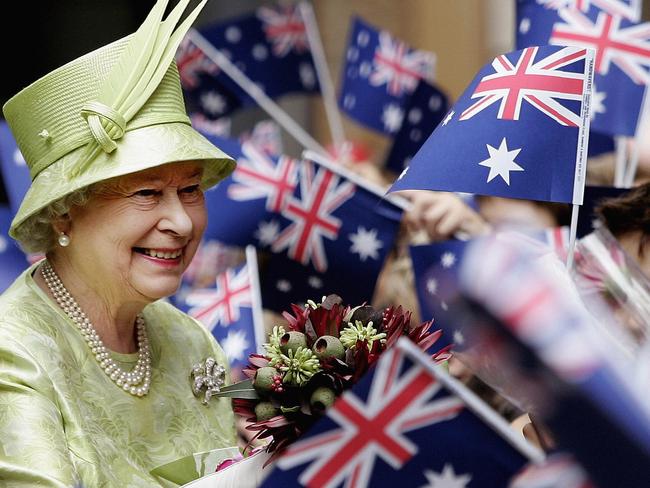 Her Majesty Queen Elizabeth II smiles amongst Australian flags being waved by the crowd after the Commonwealth Day Service March 13, 2006 in Sydney. Picture: Getty Images.