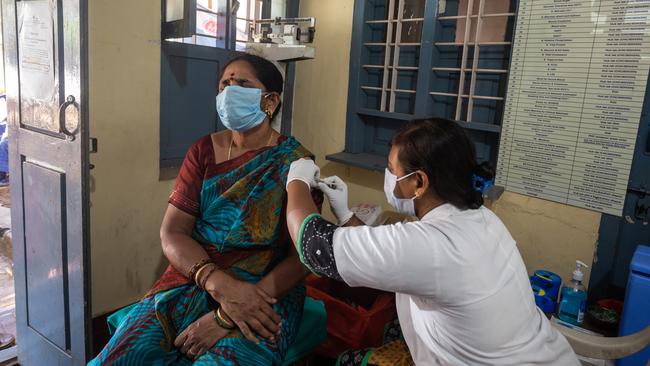 A woman gets inoculated with AstraZeneca-Oxford's vaccine at a public health centre in Mysuru, Karnataka, India. Picture: Getty Images