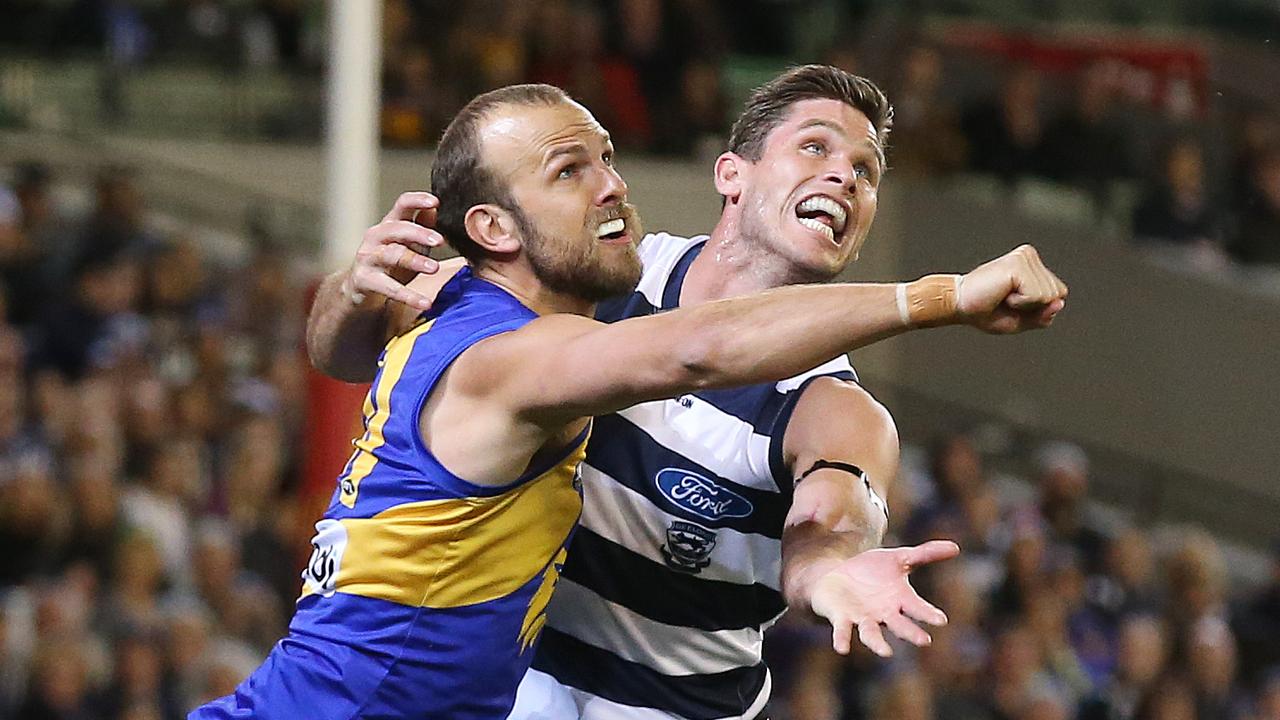 Tom Hawkins grapples with Will Schofield. Picture: Michael Klein