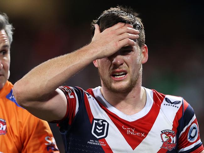 SYDNEY, AUSTRALIA - JUNE 11: Luke Keary of the Roosters holds his head as he leaves the field for an HIA during the round 14 NRL match between the Sydney Roosters and the Melbourne Storm at Sydney Cricket Ground, on June 11, 2022, in Sydney, Australia. (Photo by Mark Kolbe/Getty Images)