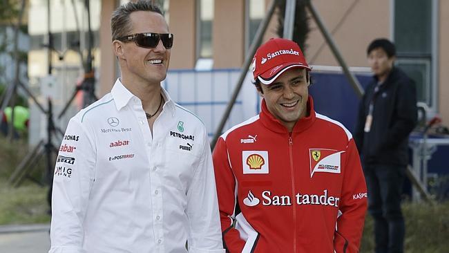 Michael Schumacher, left, with former Ferrari team-mate Felipe Massa, who shared a message of support to his fellow driver on...