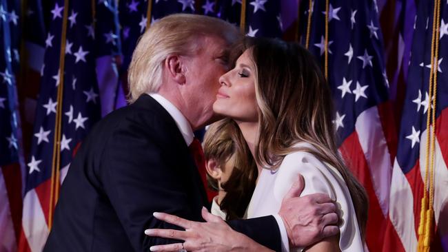 Republican president-elect Donald Trump embraces his wife Melania Trump during his election night event. Picture: Chip Somodevilla/Getty Images