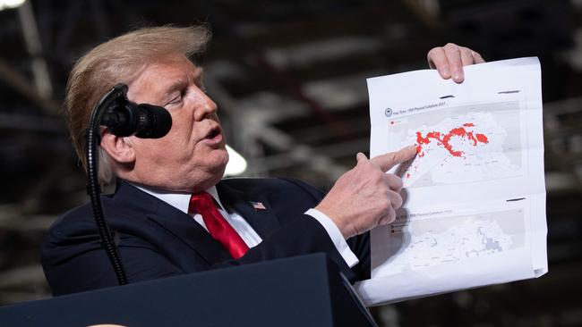 Donald Trump shows the territory lost by ISIS. Picture: AFP