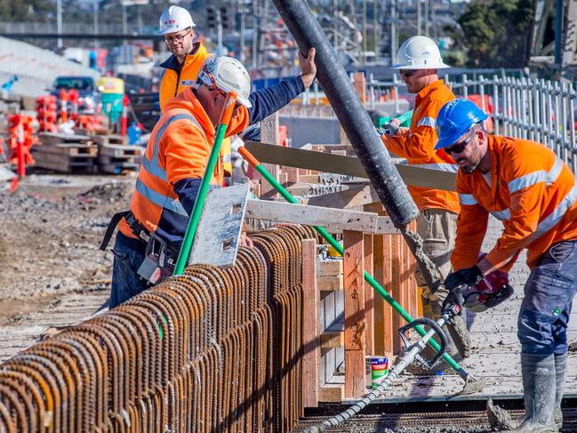 West Gate Tunnel project. Workers pour concrete at the Miller's Rd entrance to the West Gate Freeway. Picture: Jake Nowakowski