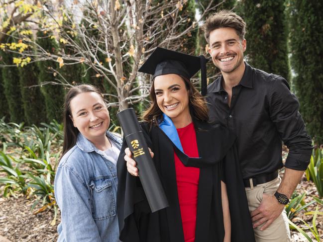 Bachelor of Nursing graduate Jessica Cova celebrates with Holly Barnes and Will Simpson at a UniSQ graduation ceremony at The Empire, Tuesday, June 25, 2024. Picture: Kevin Farmer