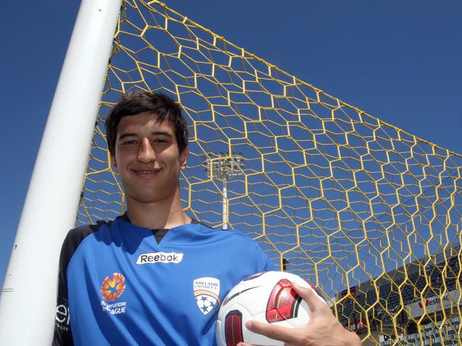 Paul Izzo after signing for Adelaide United at a teenager in 2011.